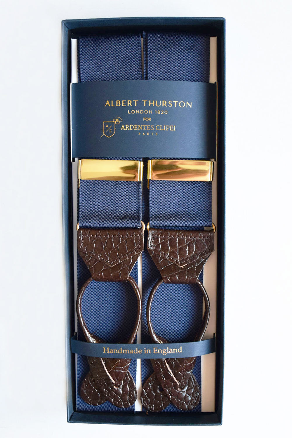 Blue navy single-buckle suspenders from Albert Thurston, with gold accents, by Ardentes Clipei, showcasing classic men's fashion accessories.