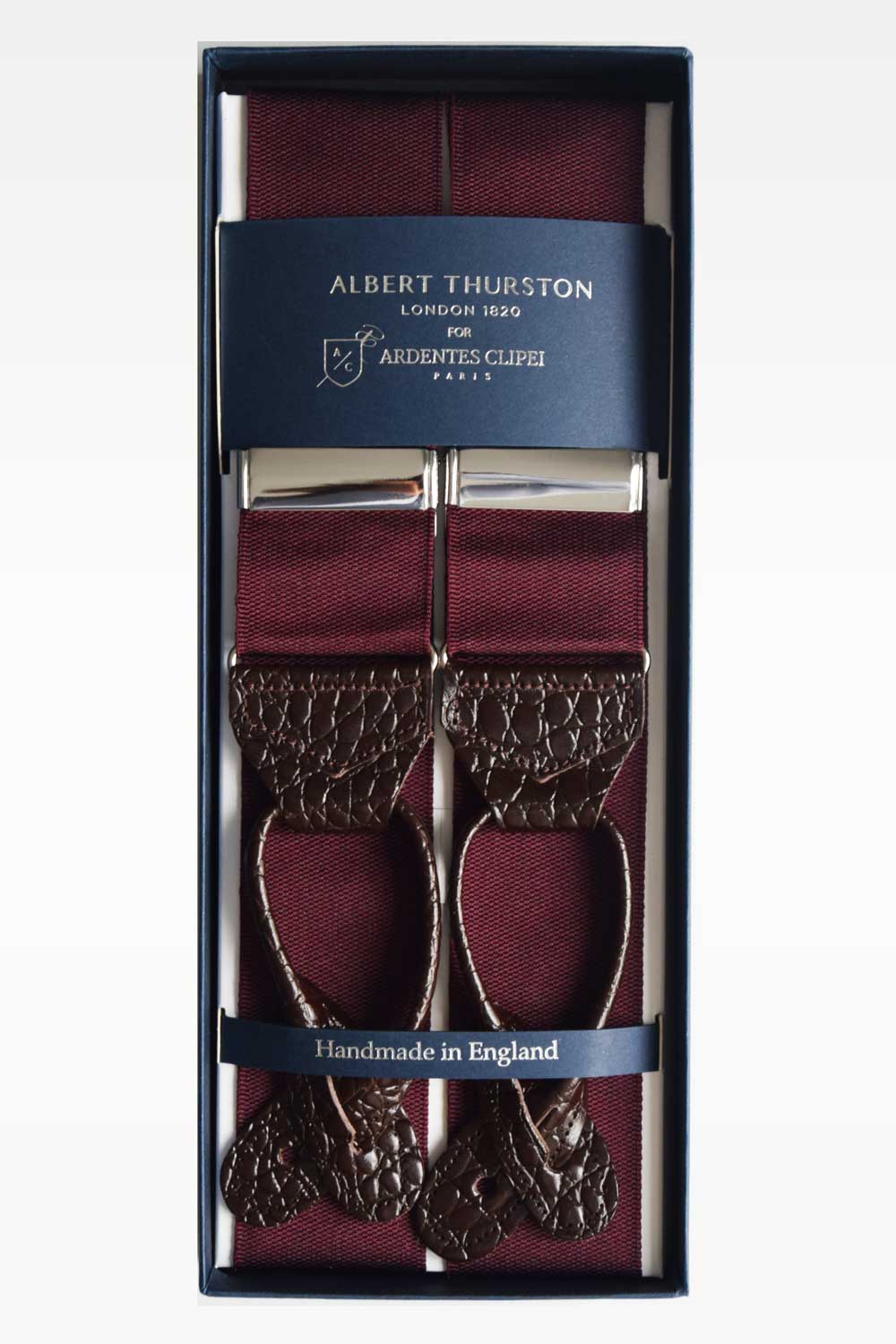Red Bordeaux Albert Thurston suspenders with adjustable straps and classic design, worn over a shirt or suit.