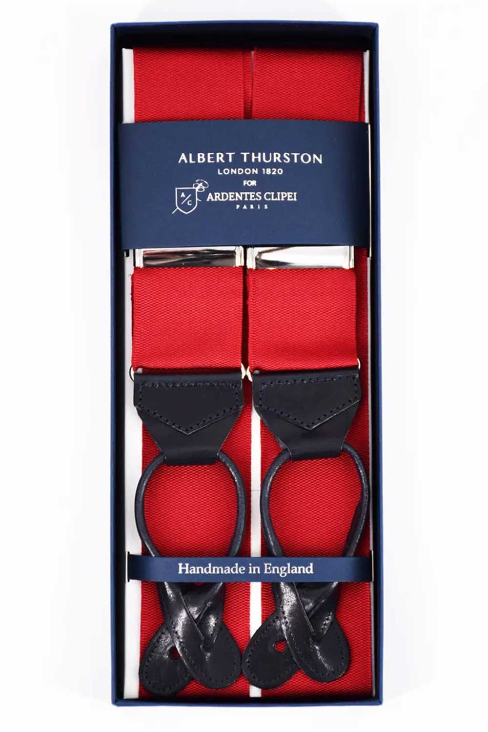 Red Albert Thurston suspenders with adjustable straps and metal clips, styled with a classic, refined look.