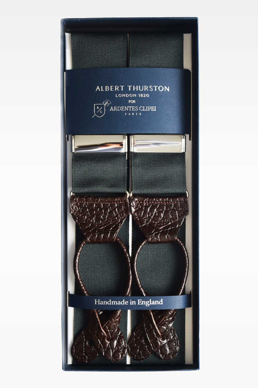 Green plain suspenders by Albert Thurston, with adjustable straps and metal clips, worn as stylish men's accessory