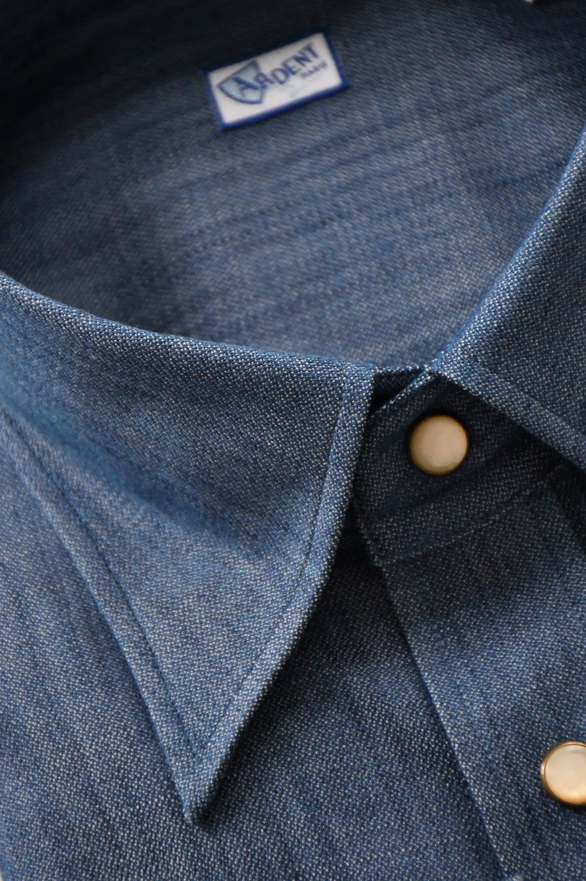 Blue denim Western chemise shirt by Ardentes Clipei, featuring classic Western style with detailed stitching and button front.