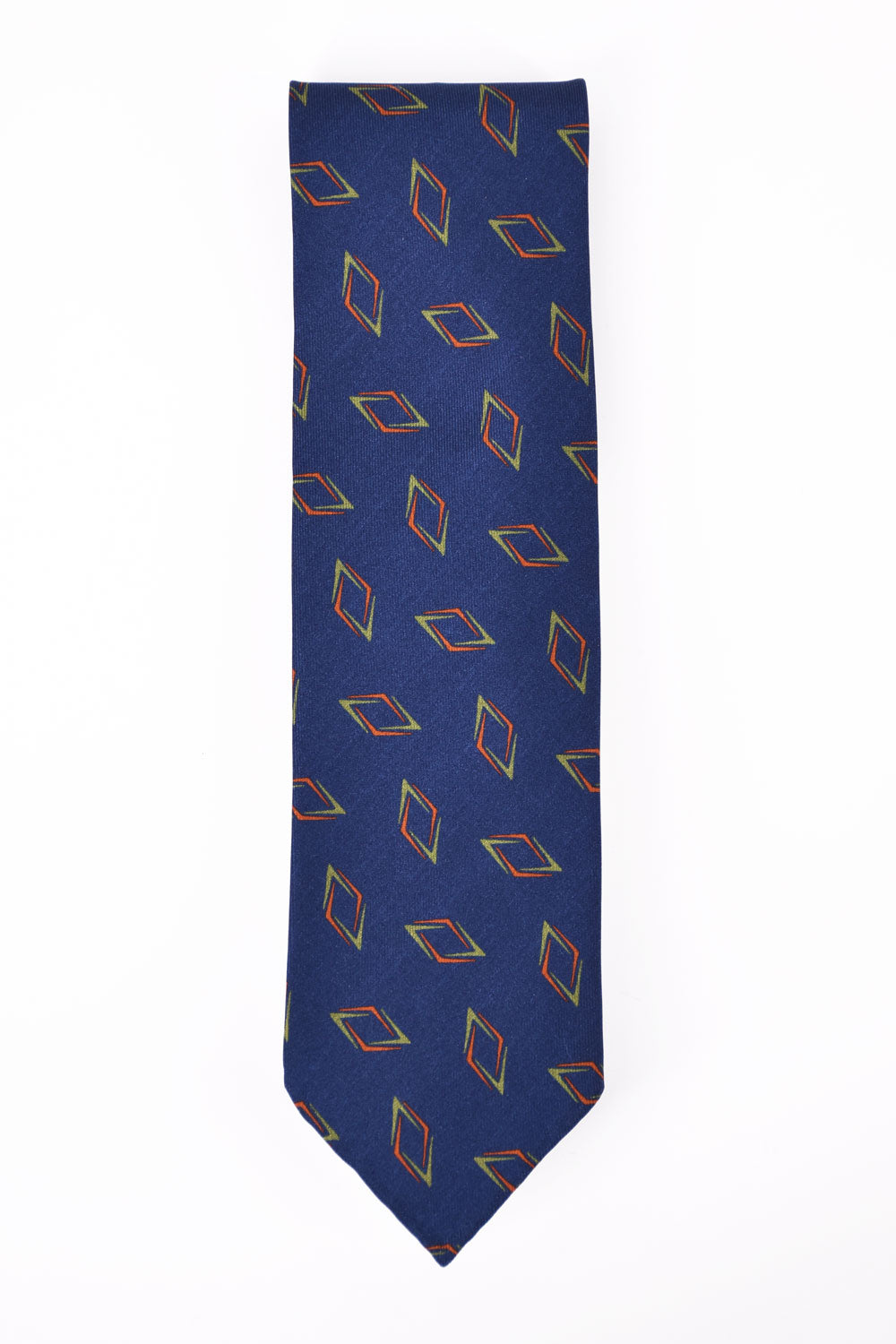 Blue tie with geometric pattern by Ardentes Clipei, showcasing intricate design and elegant fabric texture.