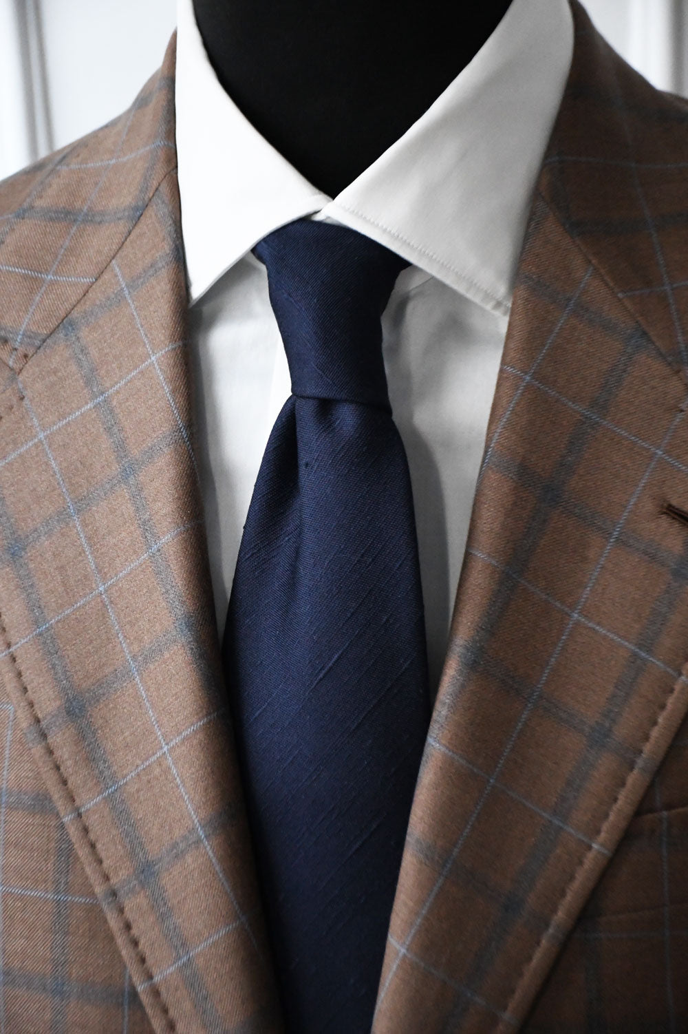 Blue Shantung silk tie by Ardentes Clipei, showcasing its textured fabric and classic design perfect for formal occasions.