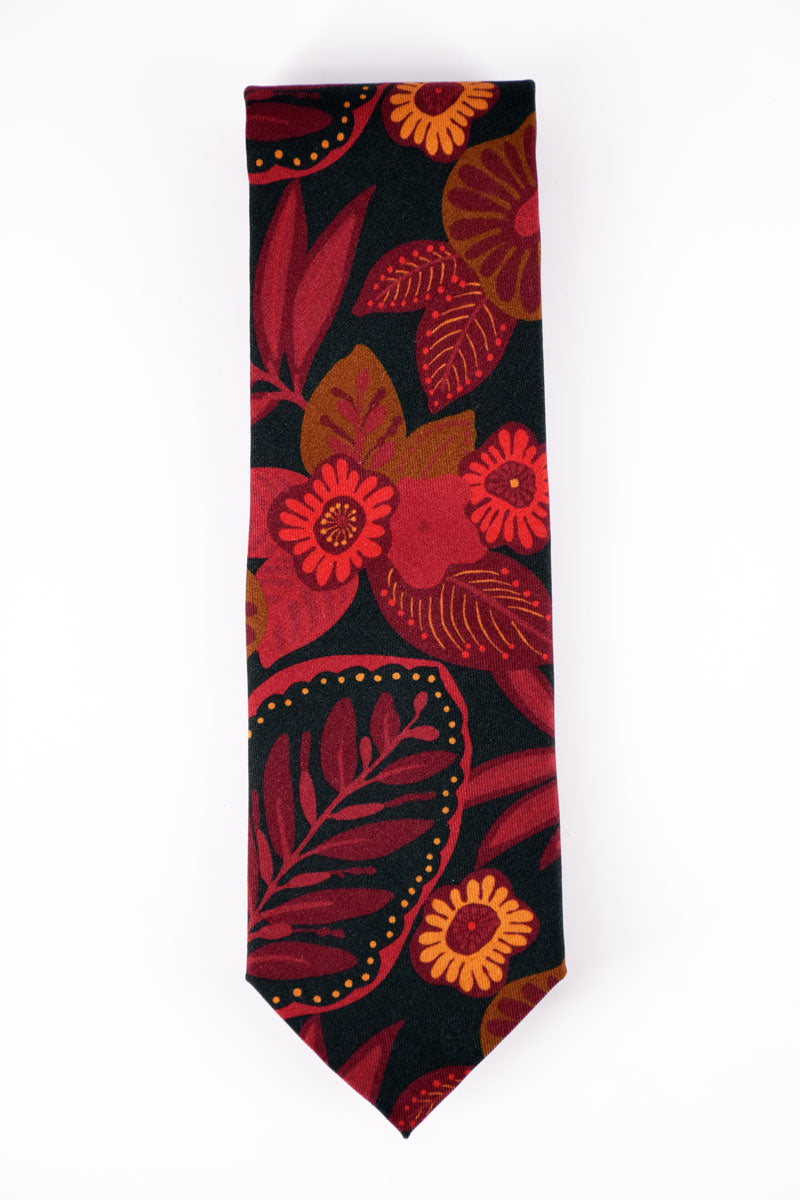 Red floral printed silk twill tie by Ardentes Clipei, showcasing elegant silk fabric and vibrant floral pattern.