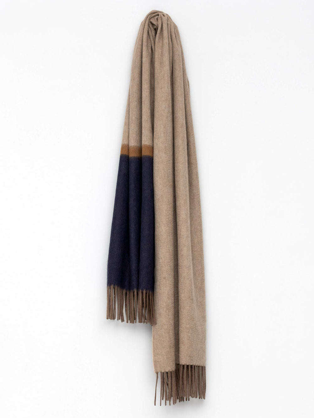 Beige and navy cashmere scarf from Begg & Co, featuring a Borderland design, shown draped with detailed fabric texture.