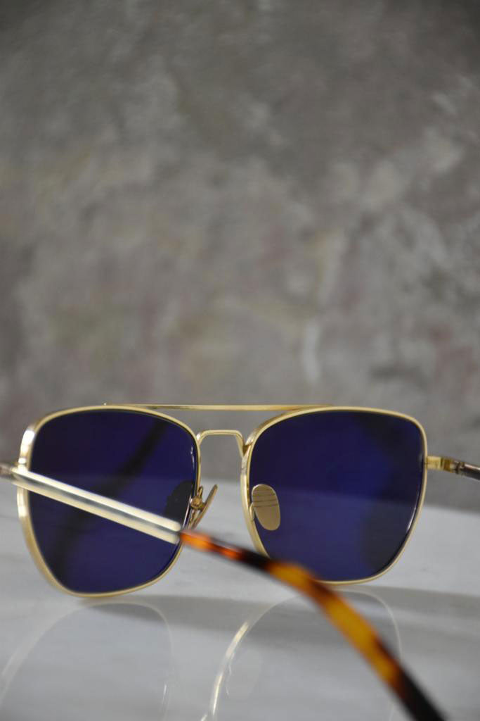 Ardentes Clipei sunglasses in vibrant green with sleek frame, stylish and modern design from The Reference Library collection.