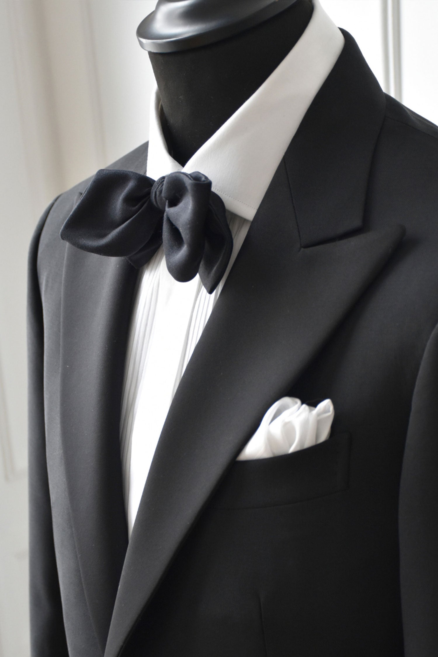 Black silk bow tie with gros-grain texture, stylish and elegant, designed by Ardentes Clipei for formal occasions.