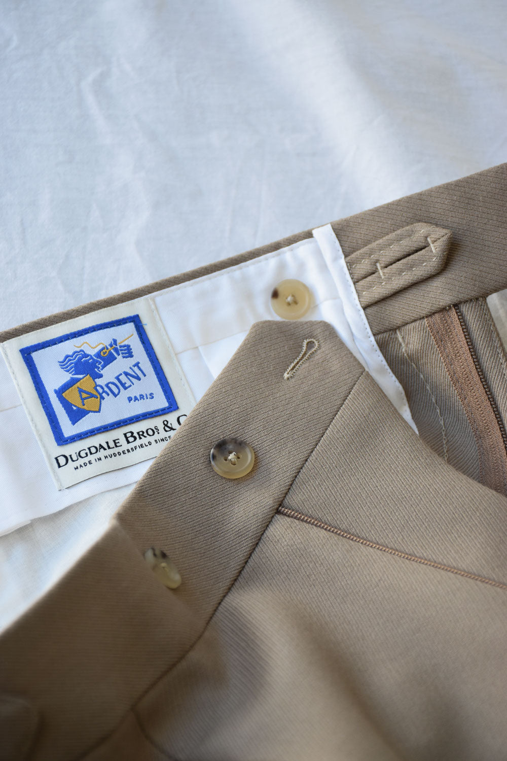 Beige Cavalry Twill Pantalon by Ardentes Clipei, casual men's trousers with a relaxed fit and classic style.
