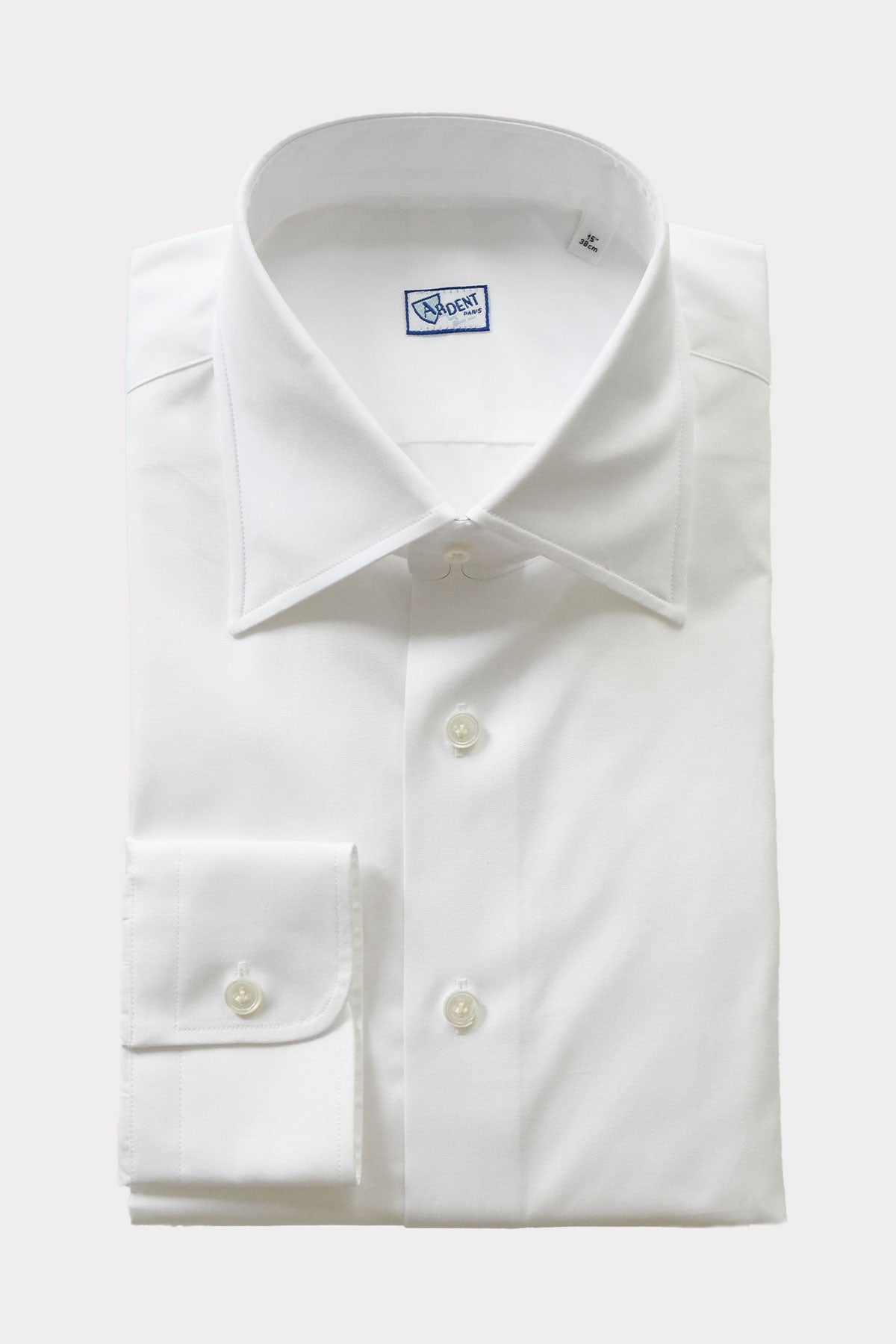 White semi-spread collar chemise by Ardentes Clipei, shown on a mannequin with long sleeves and tailored fit.