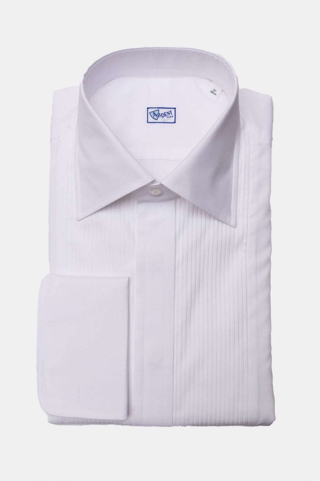 White chemise smoking with plastron by Ardentes Clipei, featuring elegant tailored design and classic lapel collar.
