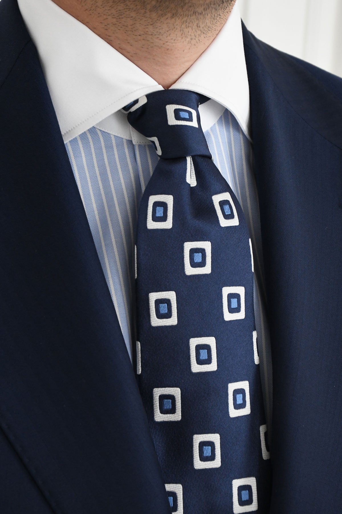 Blue striped chemise by Ardentes Clipei featuring contrasting collar and cuffs, tailored for a stylish and modern look.
