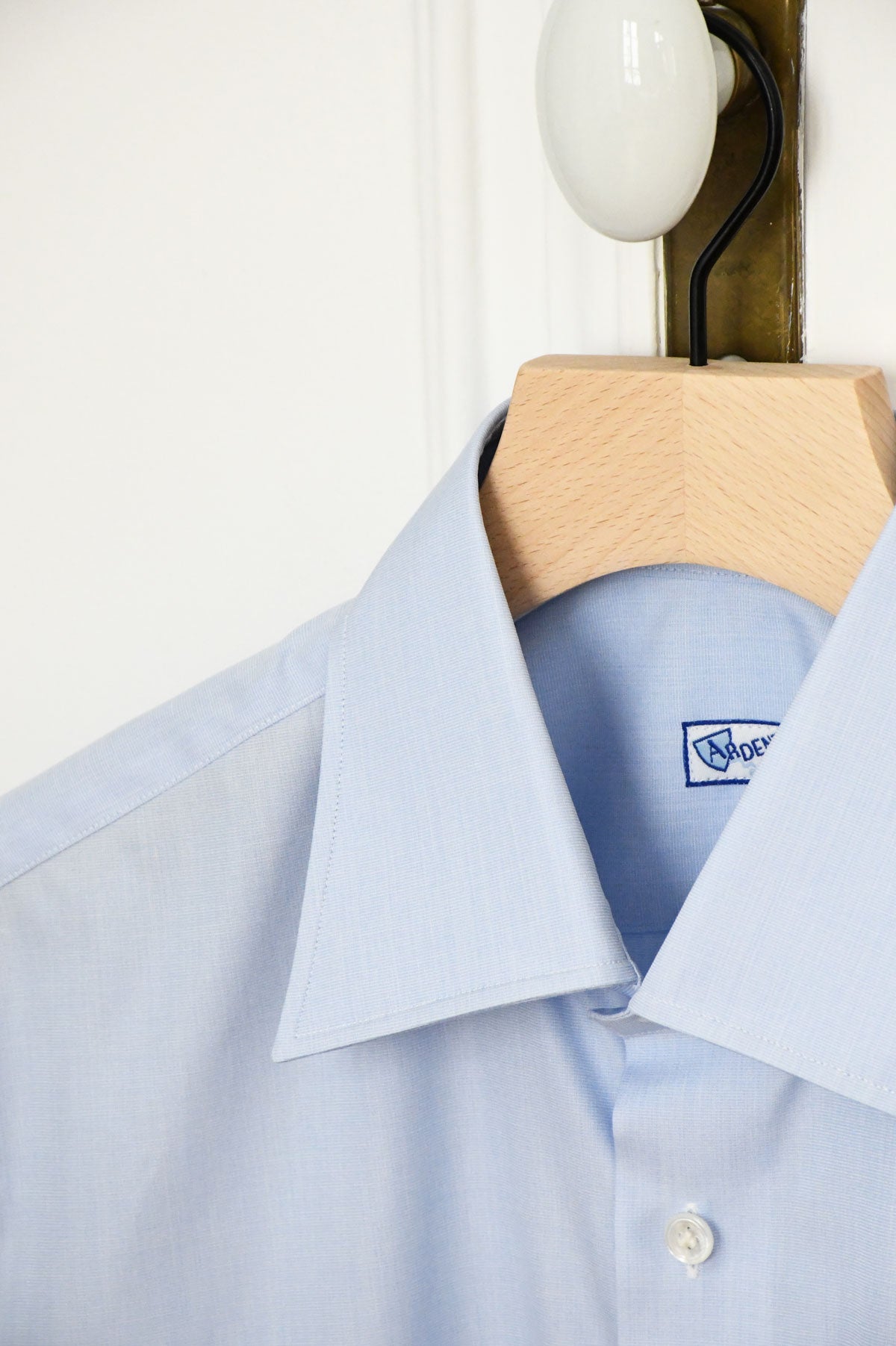 Light blue semi-spread collar chemise by Ardentes Clipei, displaying the collar and fabric details.
