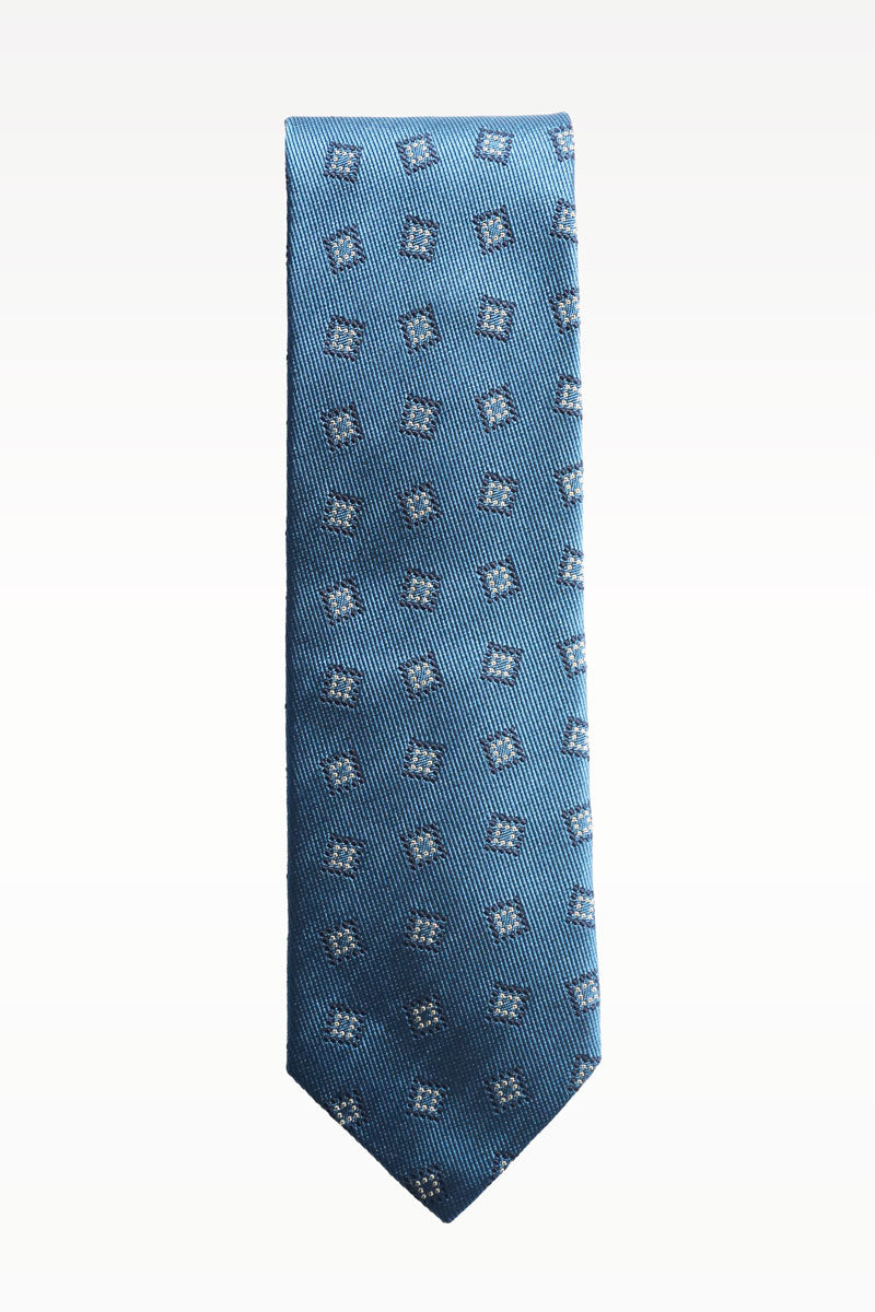 Blue silk jacquard tie by Ardentes Clipei featuring a geometric pattern, ideal for formal or stylish occasions.