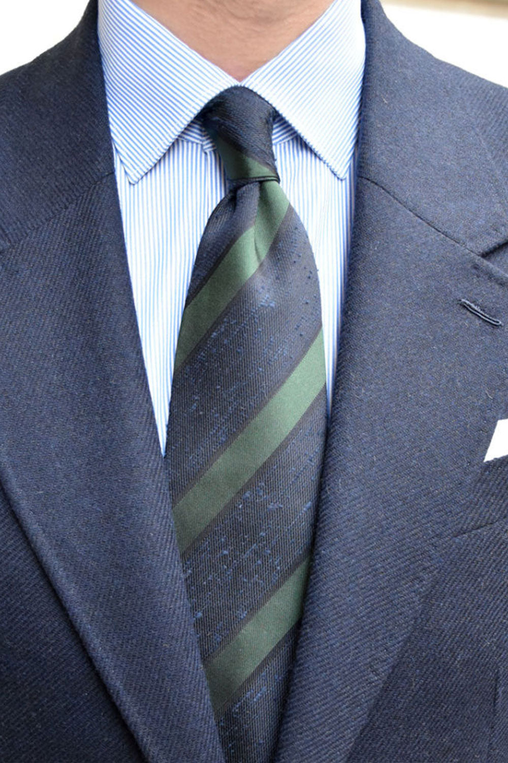Navy and green shantung club tie by Ardentes Clipei, featuring a textured fabric in a classic cravate style.