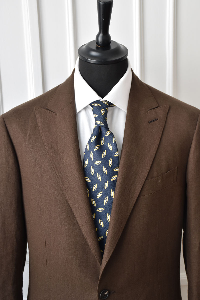 Navy tie with feather motif by Ardentes Clipei, featuring a classic design and elegant marine-inspired pattern.