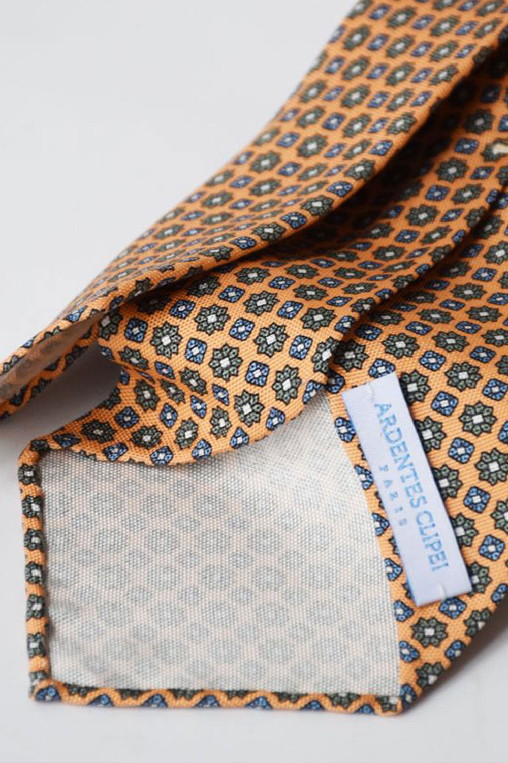 Orange pastel floral motif tie by Ardentes Clipei, showcasing a vibrant, elegant design perfect for formal or casual wear.