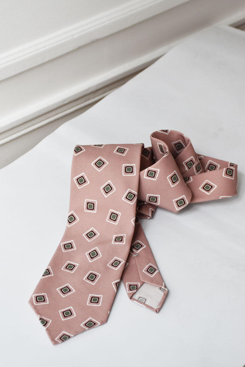 Rose geometric silk and cotton tie by Ardentes Clipei featuring a stylish pattern, perfect for formal or professional wear.