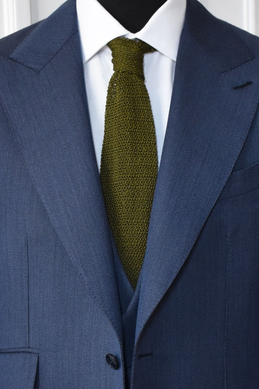 Kaki knit tie by Ardentes Clipei, showcasing textured fabric and tailored fit for a stylish men's accessory.
