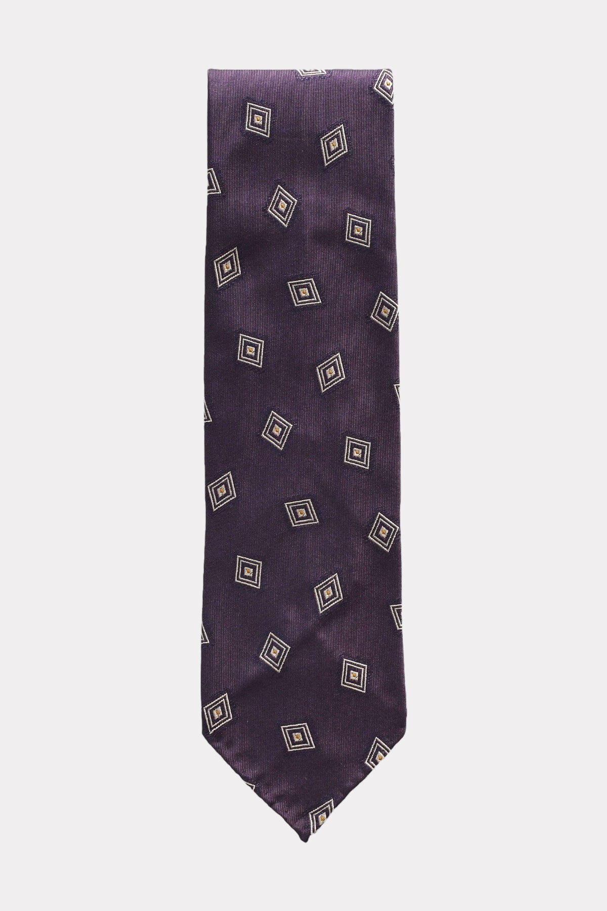 Violet silk jacquard tie with diamond pattern from Ardentes Clipei, showcasing intricate woven geometric design.