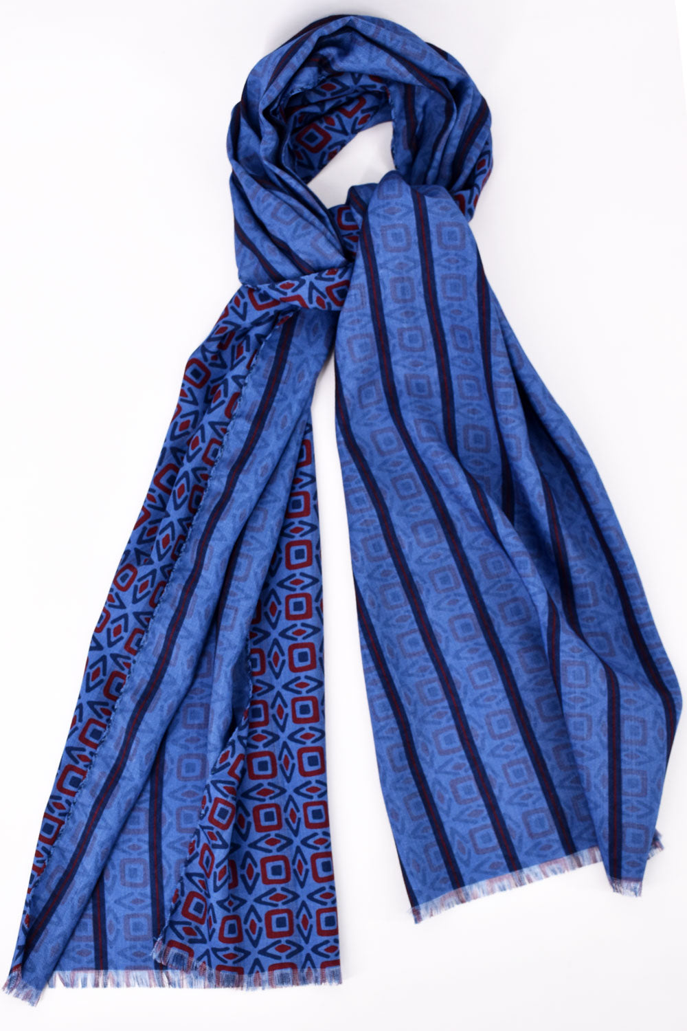 Blue and red patterned wool scarf from Ardentes Clipei, showcasing a stylish and cozy accessory with vibrant design details.