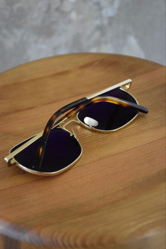 Ardentes Clipei sunglasses in smoky gray with stylish frames, designed by The Reference Library.