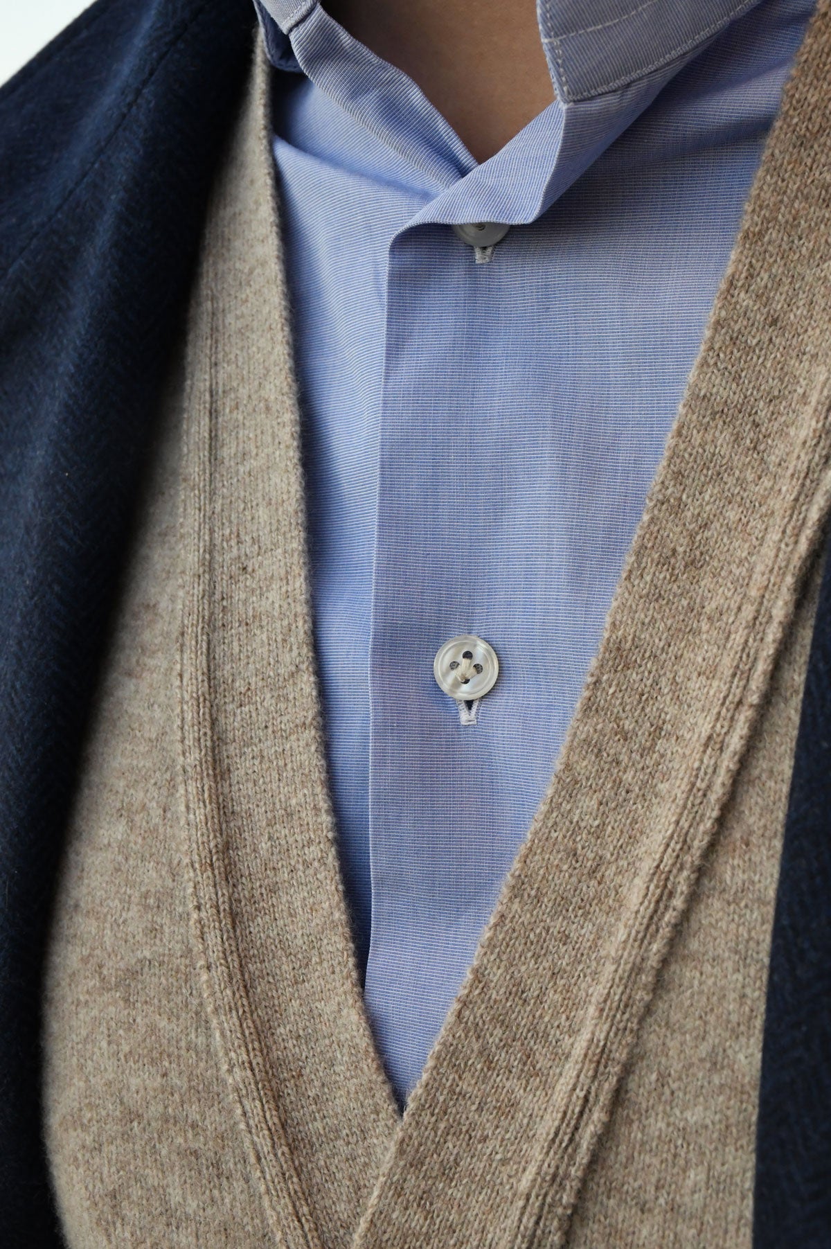 Beige mixed wool cardigan by Ardentes Clipei, lightweight knit, shown on a model, casual style with long sleeves and open front.