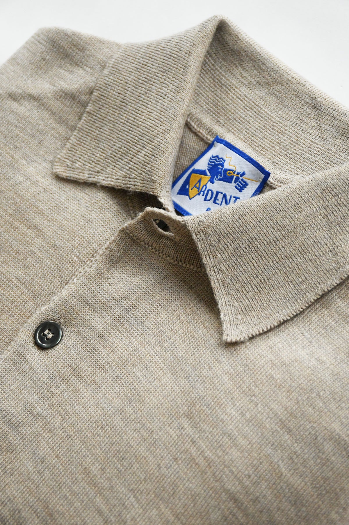Beige mixed wool merino polo collar sweater by Ardentes Clipei, front view, lightweight knit, slim fit, casual style.
