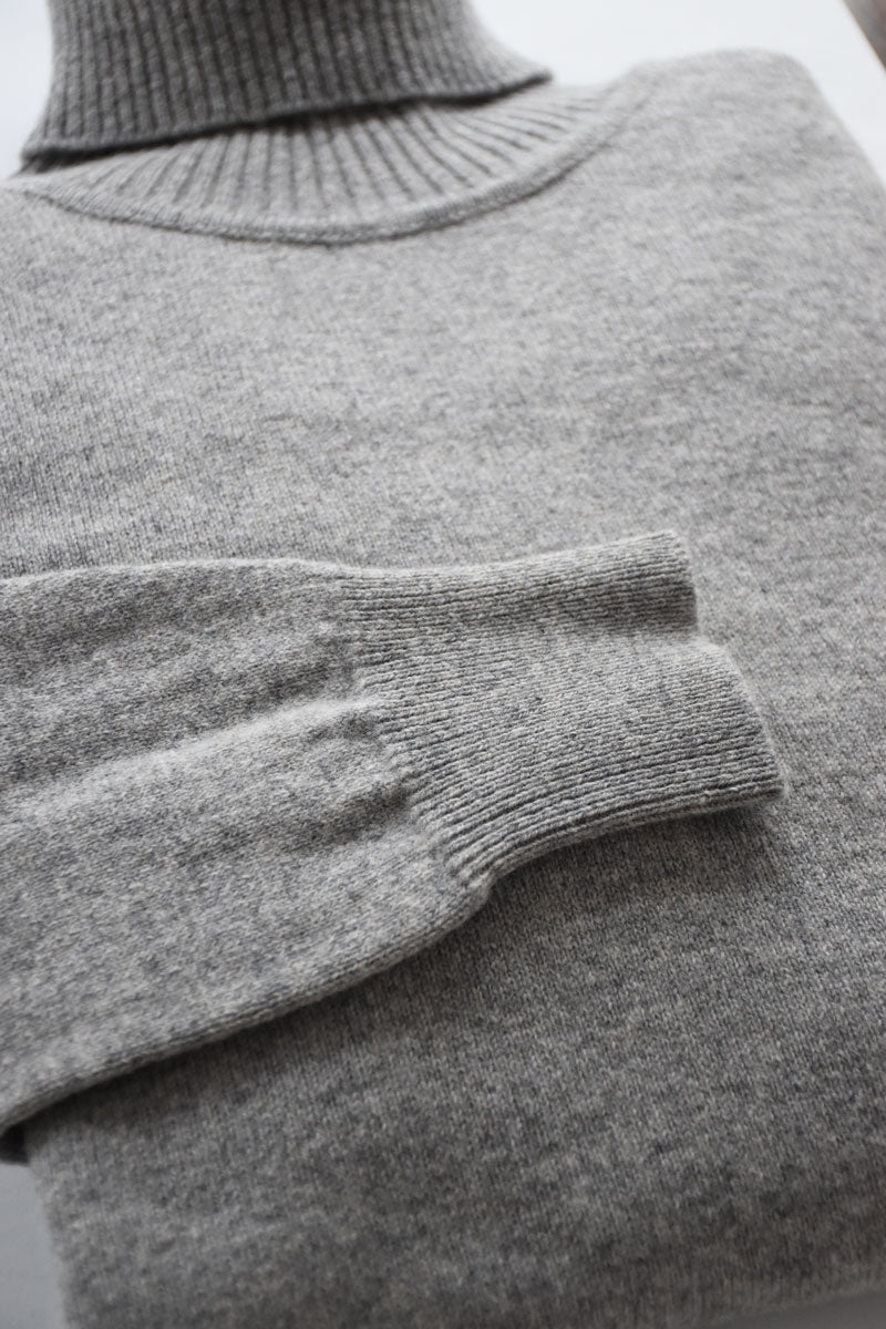 Gray lambswool turtleneck sweater by Ardentes Clipei, featuring a cozy knit design and classic collar.