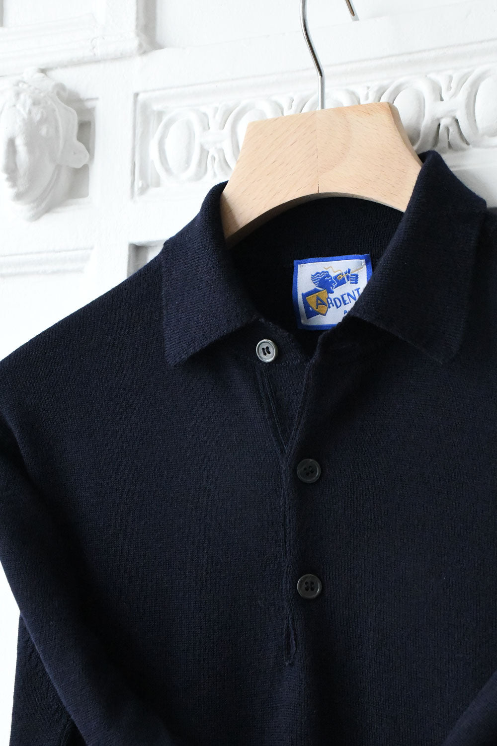 Blue navy merino wool polo collar sweater by Ardentes Clipei, shown in size XS with detailed knit texture.