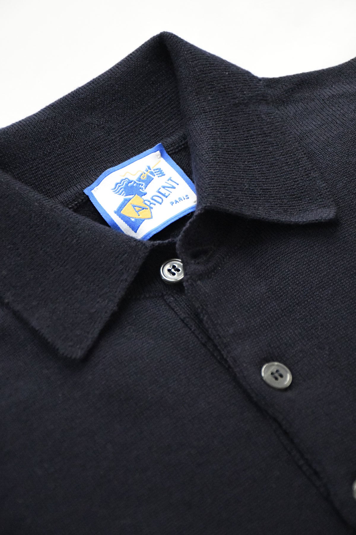Blue marine merino wool polo collar sweater by Ardentes Clipei, featuring a classic knit design and fitted style.