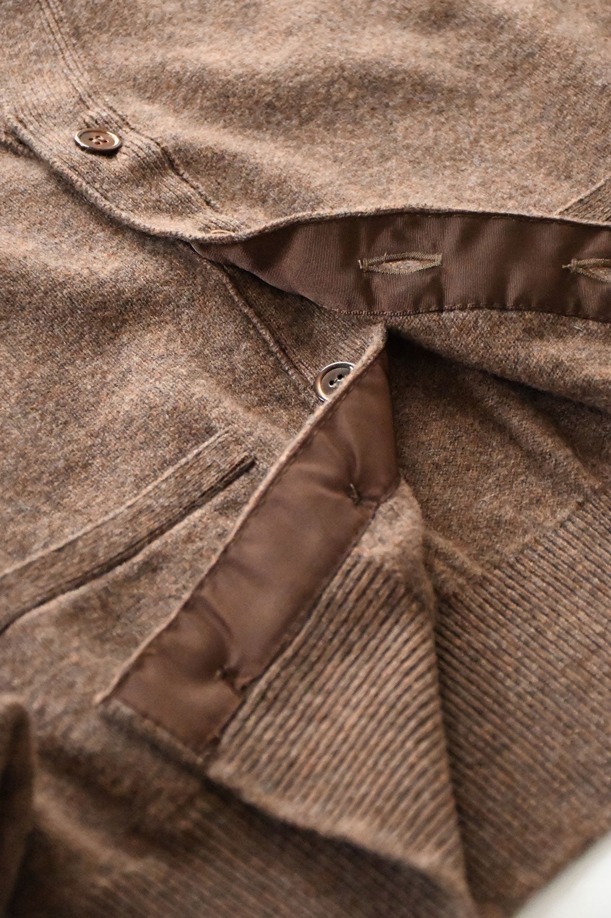 Light brown mixed wool cardigan from Ardentes Clipei, showing the cozy knit texture and slim fit design.