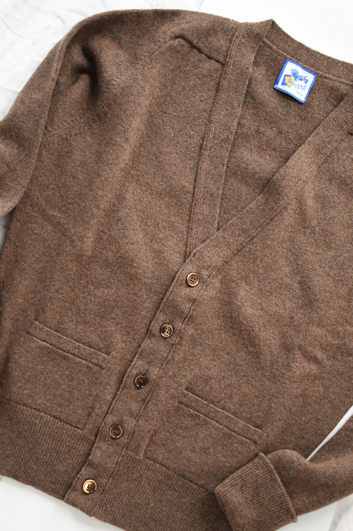 Ardent's brown mixed wool cardigan in XS, made of soft lamb's wool, featuring a cozy knit texture and classic design.