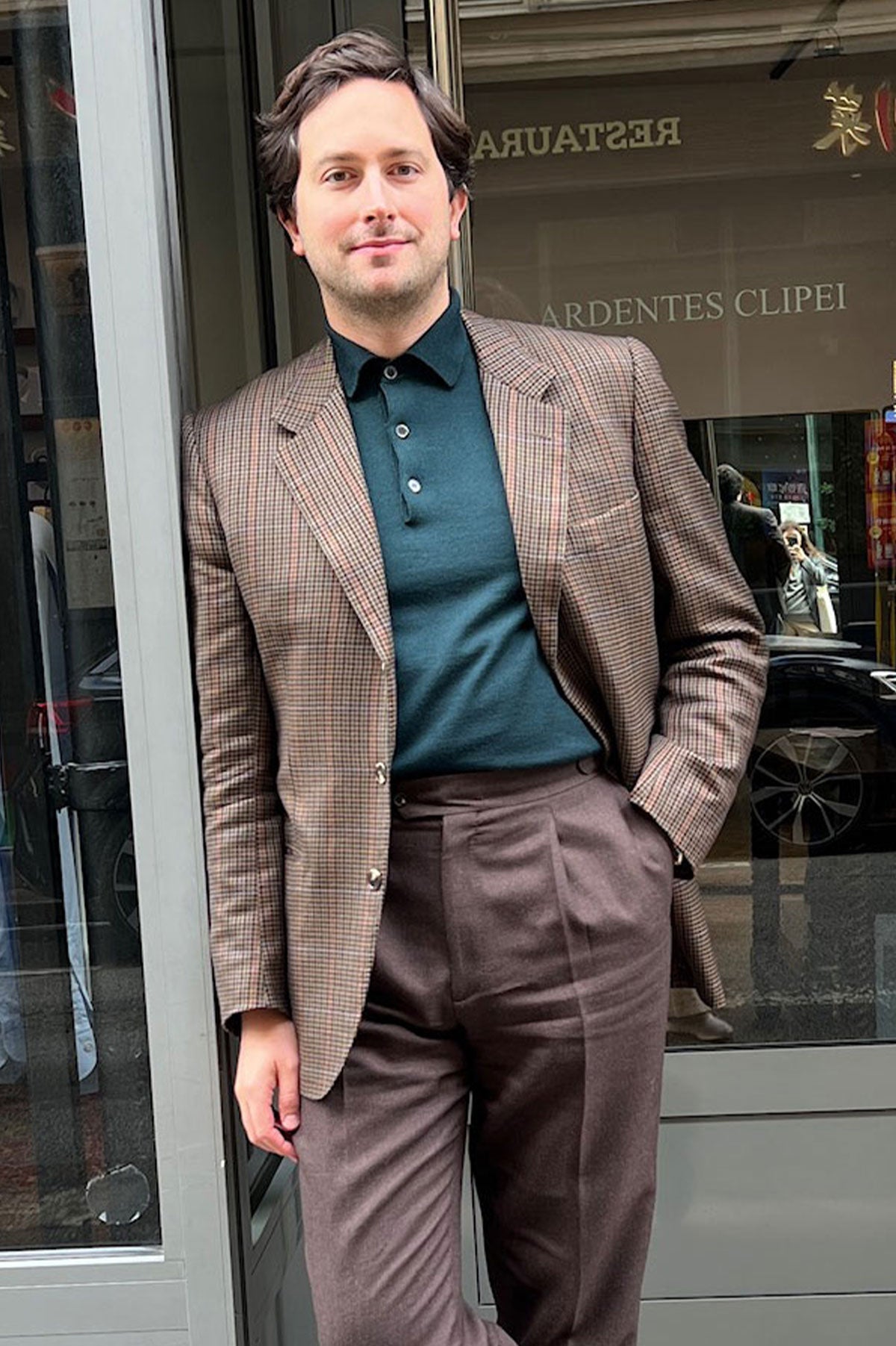 Green merino wool polo collar knit sweater by Ardentes Clipei, showing the textured fabric and classic design.