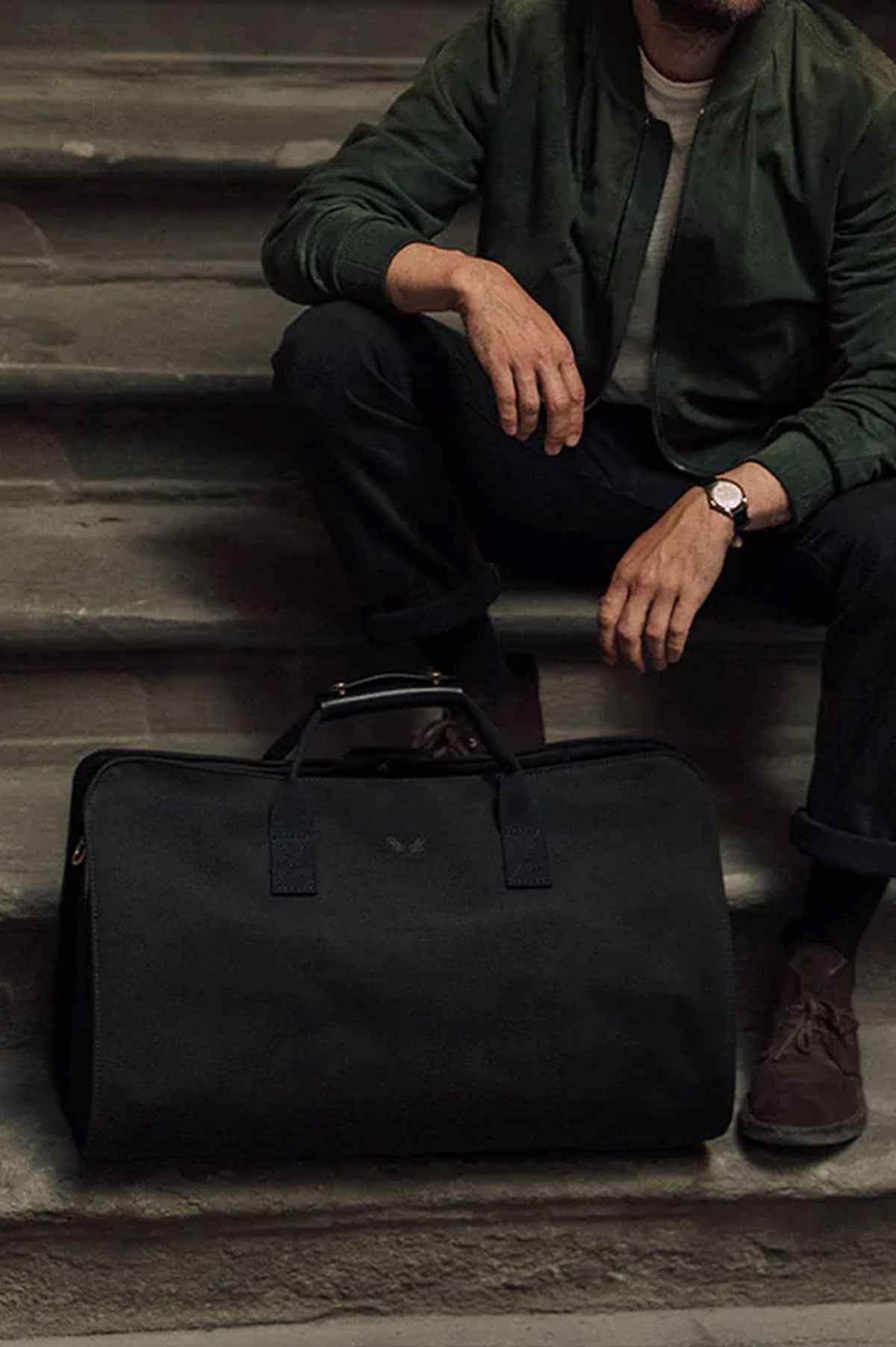 Black Bennett Winch Suit Carrier Holdall for convenient travel, featuring a sleek design and durable marquinerie craftsmanship.