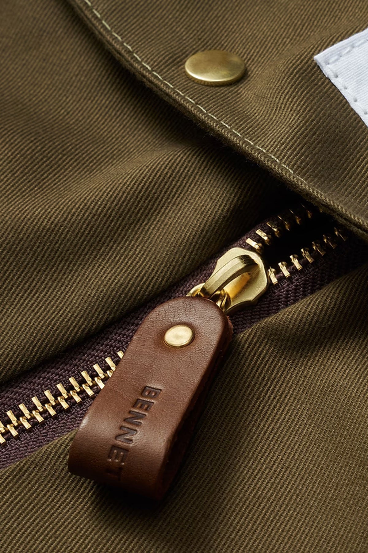 Olive green Bennett Winch suit carrier holdall, a stylish marquinerie bag designed for transporting suits and garments.