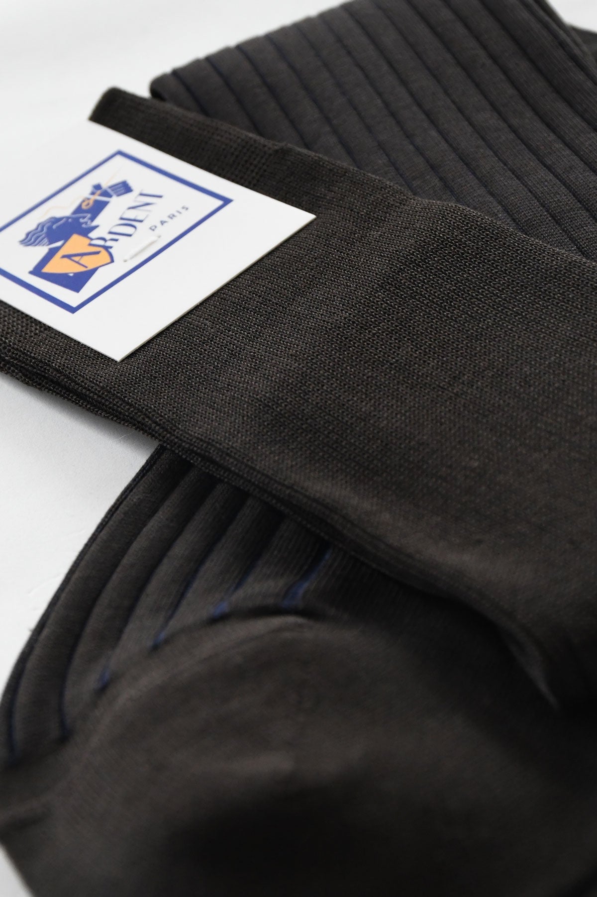 Pair of Ardentes Clipei brown mid-calf socks with navy blue stripes, shown laid flat for display.
