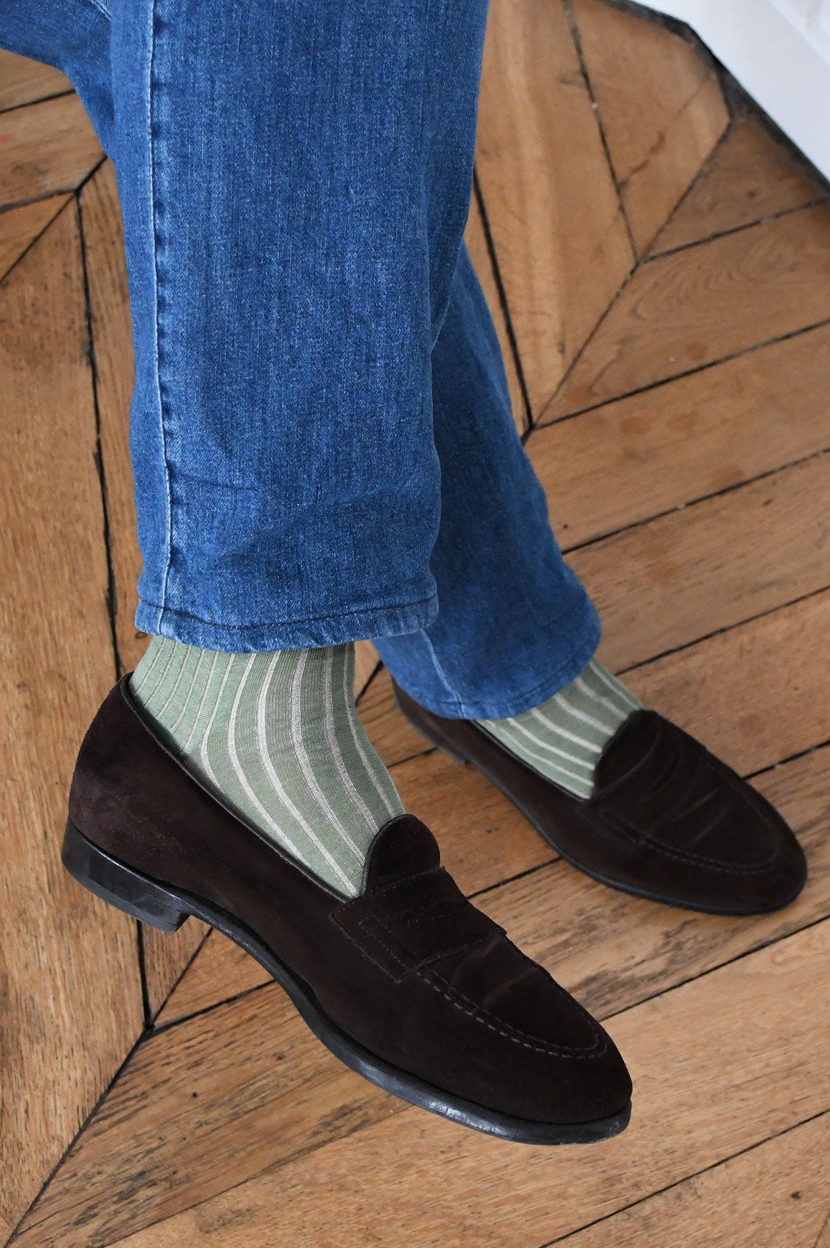 Kaki and beige fine striped mi-bas socks by Ardentes Clipei, shown on a model's legs.