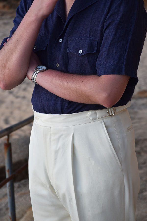 Cream white cotton wool blend pants by Ardentes Clipei, with a relaxed fit and stylish design.